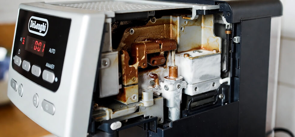 Засорение термоблока накипью или кофейными отложениями кофемашины Делонги